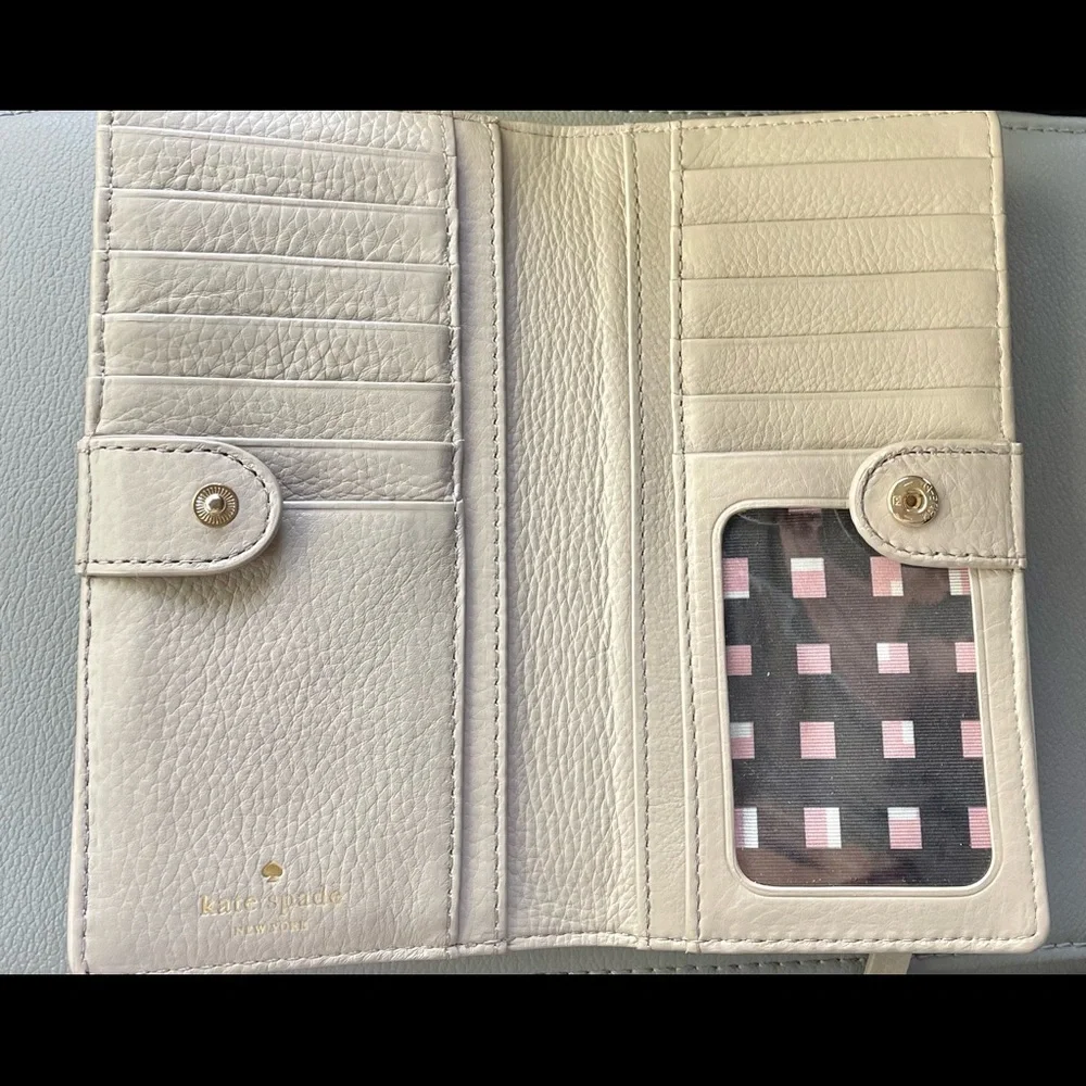 kate spade pale pink bow zip-around wallet